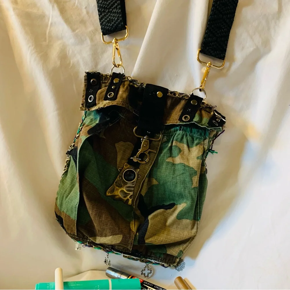 Camouflage Crossbody Bag with Gold Accents and Image of JK Punkmetal Sculpture. - Picture 3 of 7